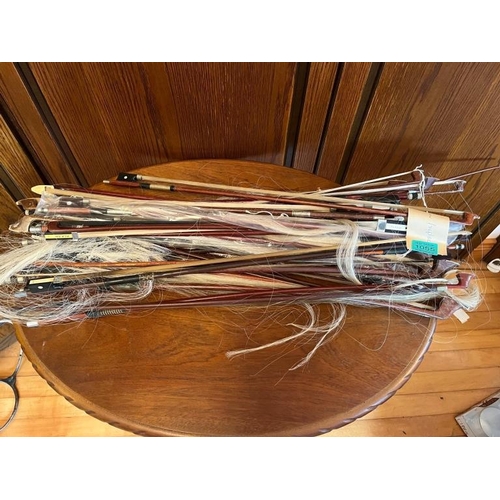 Collection of fiddle bows.