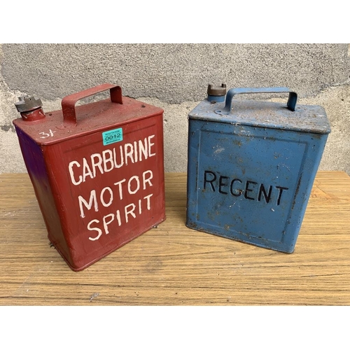 12 - Two oil cans, Carburine and Regent complete with brass tops. {W 25 cm x H 32 cm H x D 15 cm}