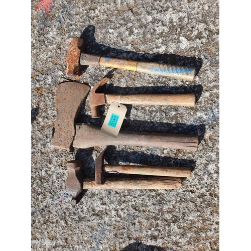 140 - Assortment of hammers an pick axe.