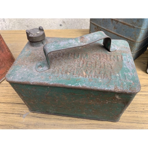 15 - Four Vintage Jerry cans. {Largest W 24 cm x H 17 cm x D 10 cm}