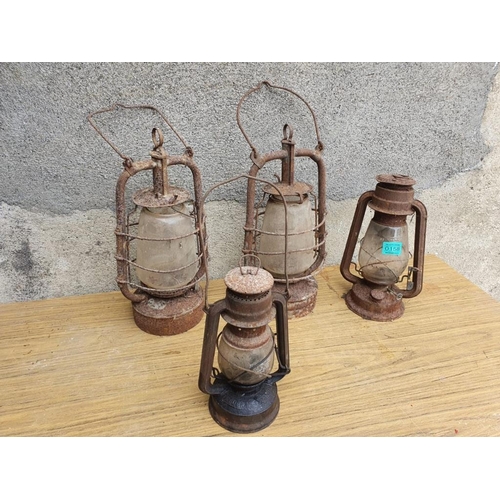 158 - Four antique oil lamps as found. {Largest W 22 cm x H 50 cm}