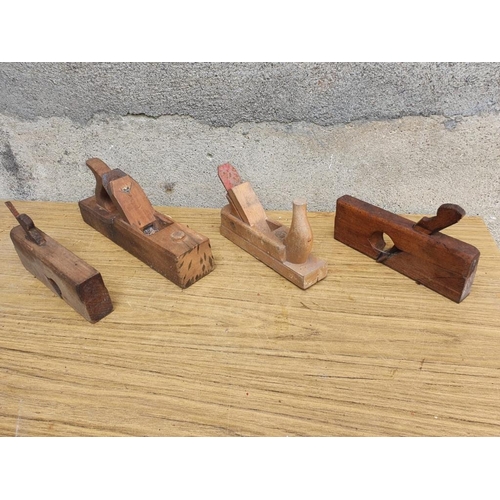 159 - Four antique wooden planes. {Largest W 35 cm x H 16 cm x D 10 cm}