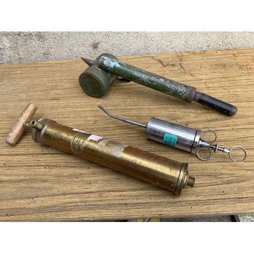 189 - Brass pump, disinfector and syringe.