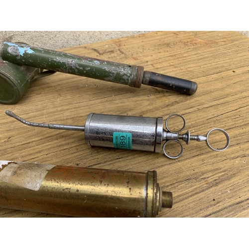 189 - Brass pump, disinfector and syringe.