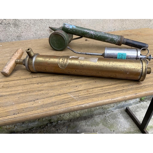 189 - Brass pump, disinfector and syringe.