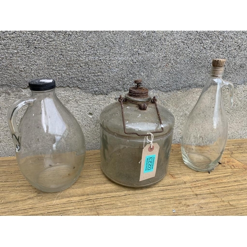 223 - Three vintage glass bottles. {Largest H 30cm}