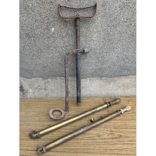 231 - Two antique brass sprayers and foot pump. {Largest H 70 cm}