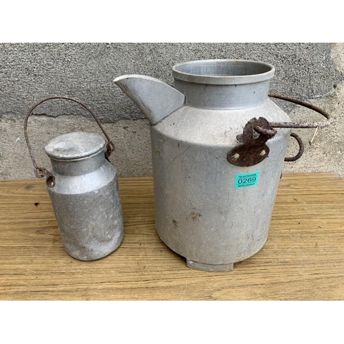 269 - Miniature milk can and a milk can with a carrying handle. {Largest W 30 cm x H 50 cm}