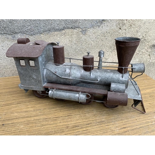 270 - Model train and car and motor bike. {W 37 cm x H 20 cm x D 15 cm}