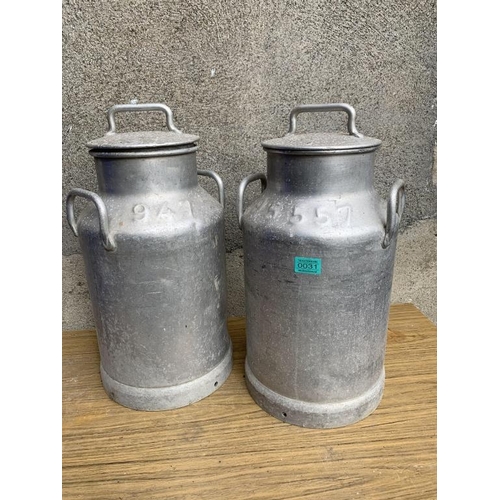 31 - Two milk cans. {W30 cm x H 50 cm}