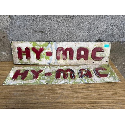 329 - Two aluminium Hy-Mac signs. {Largest 59 cm W x 22 cm H}