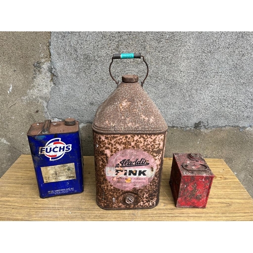 334 - Three petrol cans including Aladdin Pink. {24 cm W x 56 cm H}