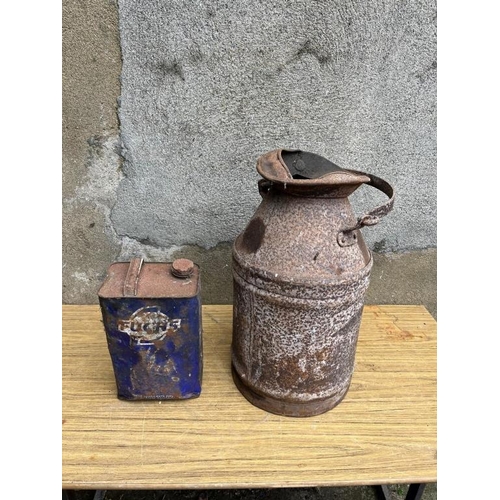 337 - Oil measuring can and a petrol can. {35 cm W x 50 cm H}