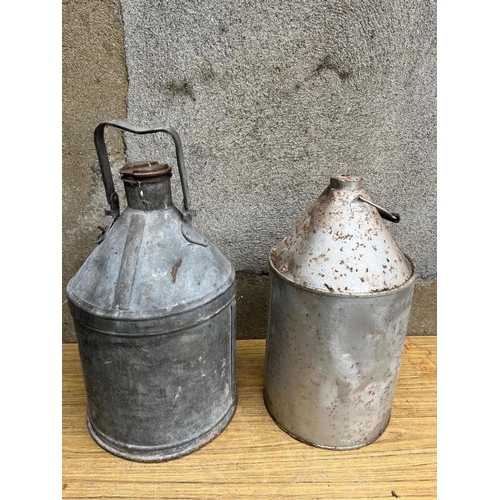 341 - Two vintage oil cans. {Largest 32 cm W x 60 cm H}