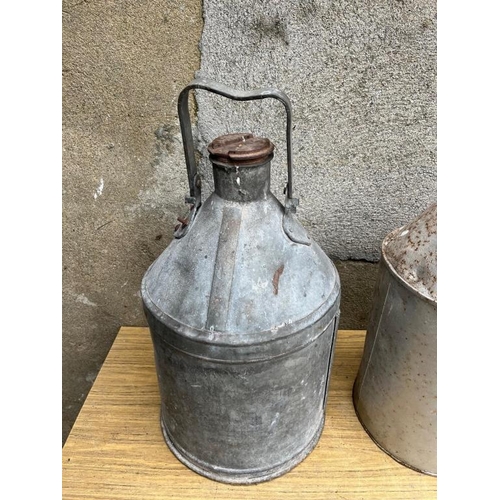 341 - Two vintage oil cans. {Largest 32 cm W x 60 cm H}