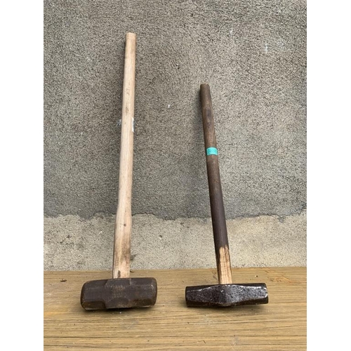 35 - Two sledge hammers.