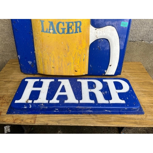 396 - Two vintage plastic Harp advertisements. {Largest 74 cm W x 64 cm H}