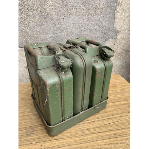 4 - Set of three Jerry cans complete with tray. {W 30 cm x H 30 cm x D 25 cm}