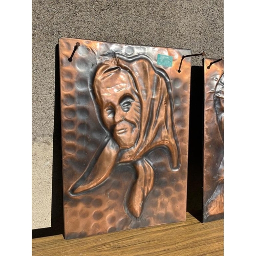 400 - Pair of copper panels of a male and female. {31 cm W x 44 cm H}