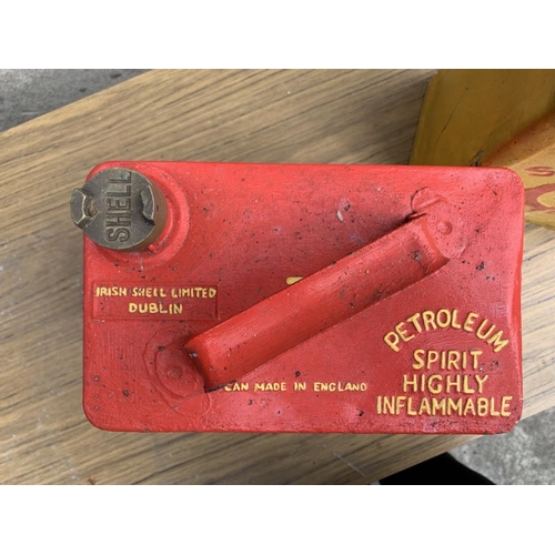 5 - Two Shell oil cans, one bearing Irish Shell Ltd. Dublin. {W 24 cm x H 32 cm x D 15 cm}