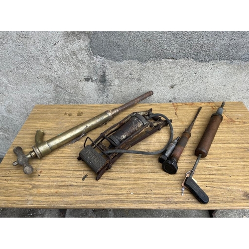 528 - Satty brass foot pump and three grease guns.