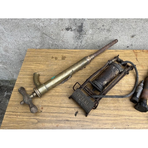 528 - Satty brass foot pump and three grease guns.