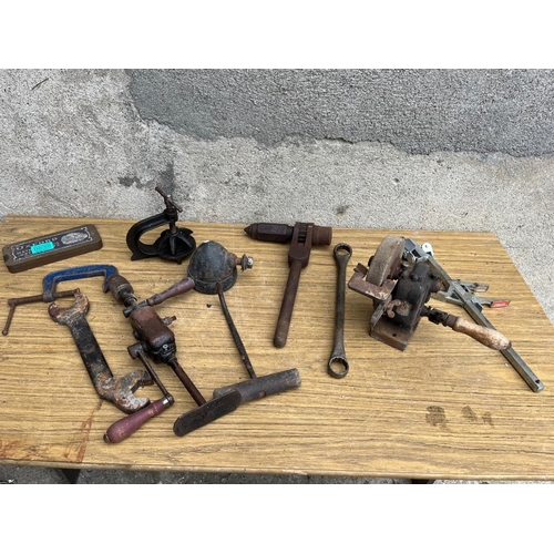 535 - Collection of items including clamps, grinding stone and drill.