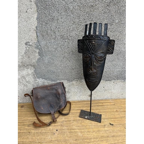 537 - Leather seed bag and an African sculpture.