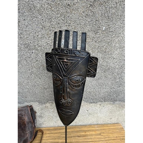 537 - Leather seed bag and an African sculpture.