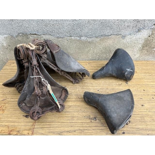 591 - Collection of vintage bicycle saddles.