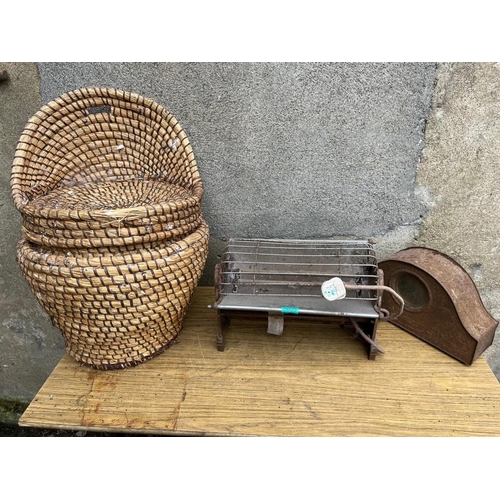 600 - Vintage heater, metal clock case and a wicker basket.