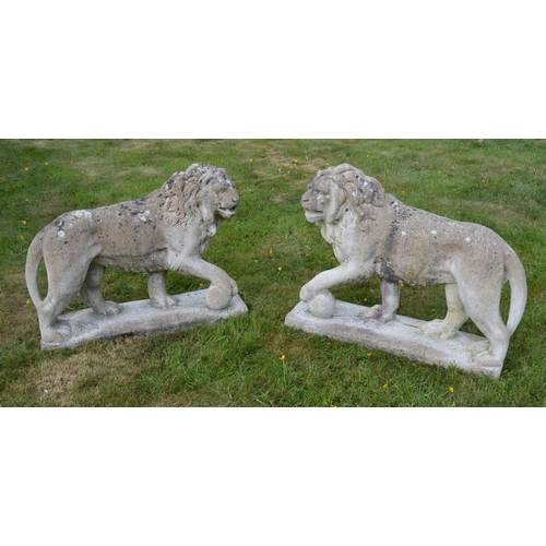 620 - Stone Figures of Lions with paw resting on a Ball