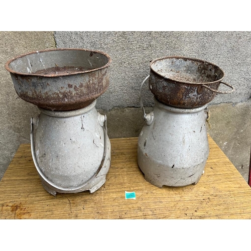 680 - Pair of small milk cans with strainers. {31 cm W x 52 cm H}