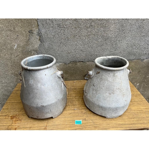 682 - Pair of small milk cans. Pair of small milk cans. {32 cm W x 39 cm H}