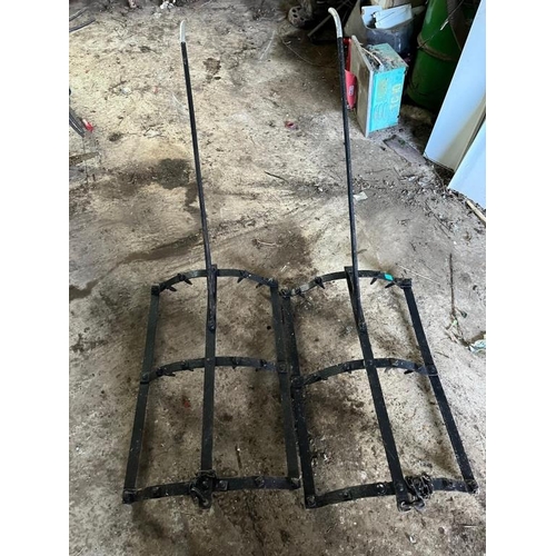 843 - Two vintage cast iron saddle harrows. {56 cm W x 86 cm H x 170 cm D each}