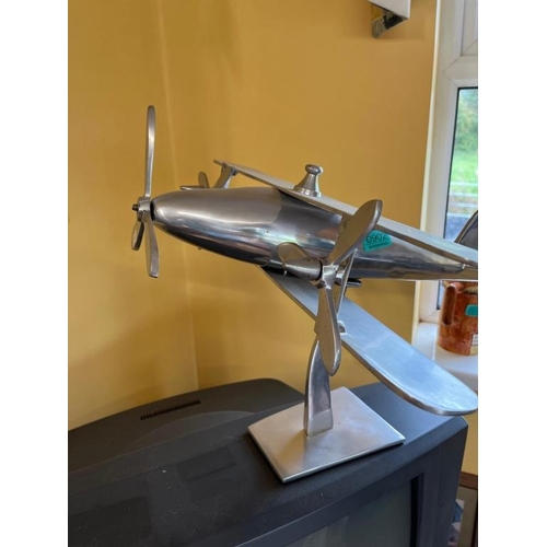 902 - Aluminium model of a plane. {50 cm W x 35 cm H x 45 cm D}