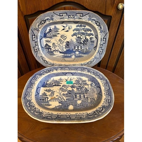 918 - Two antique willow pattern platters both bearing Staffordshire stamp.