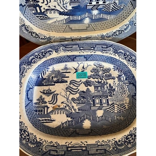 918 - Two antique willow pattern platters both bearing Staffordshire stamp.