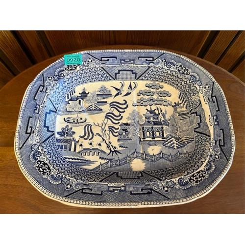 920 - Willow pattern platter with well. {43 cm W x 34 cm H}