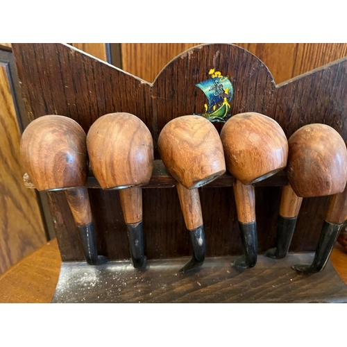 925s - Two vintage pipe racks with pipes.