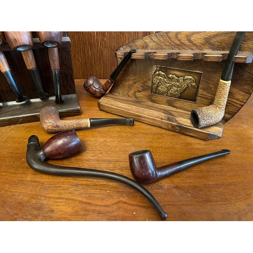 925s - Two vintage pipe racks with pipes.