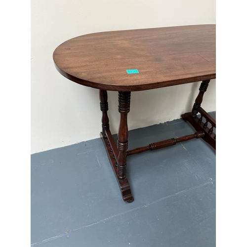 237 - Victorian Oval Mahogany Library Table on turned supports with stretcher base (107cm x 70cm x 50cm)