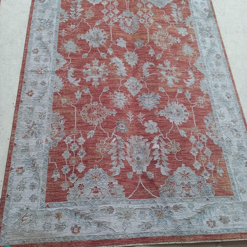 1 - An Ivory and Rust Ground Carpet (approx 3m x 2m)