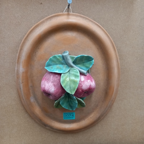 74 - Decorative Oval Terracotta Plaque and a pair of Metal Candlestands