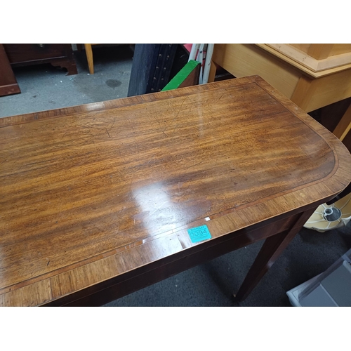 94 - Georgian Mahogany Games Table Inlaid and Cross banded with Rosewood on tapered legs