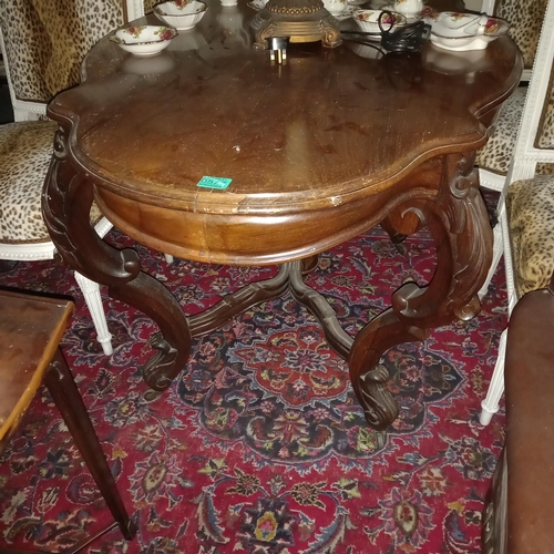 577 - 19th Century French Rosewood Centre table of serpentine form