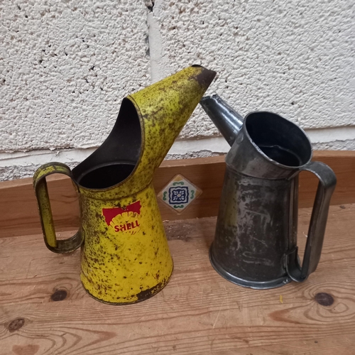 310 - Two old Quart Size Oil Pouring Measures