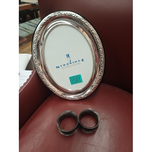 727 - Pair of Irish Silver Serviette Rings and a Newbridge Silverware Picture Frame