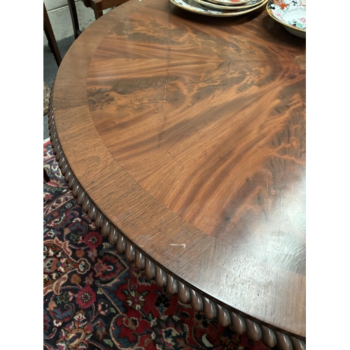 897 - Victorian Mahogany Circular Breakfast Table with flame veneered Top on tapering circular column and ... 