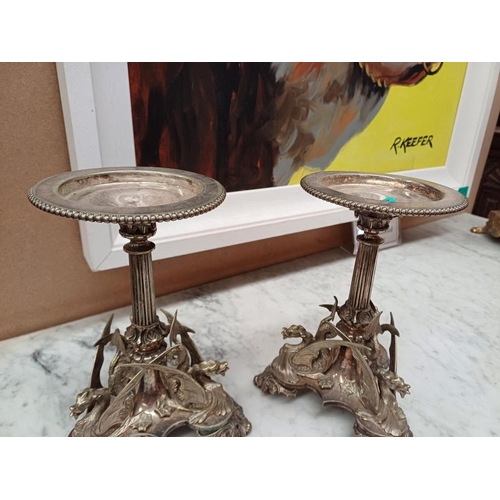 126 - Pair of Ornate Silver Plate Candle Stands on Griffin Decorated Columns (22cm)